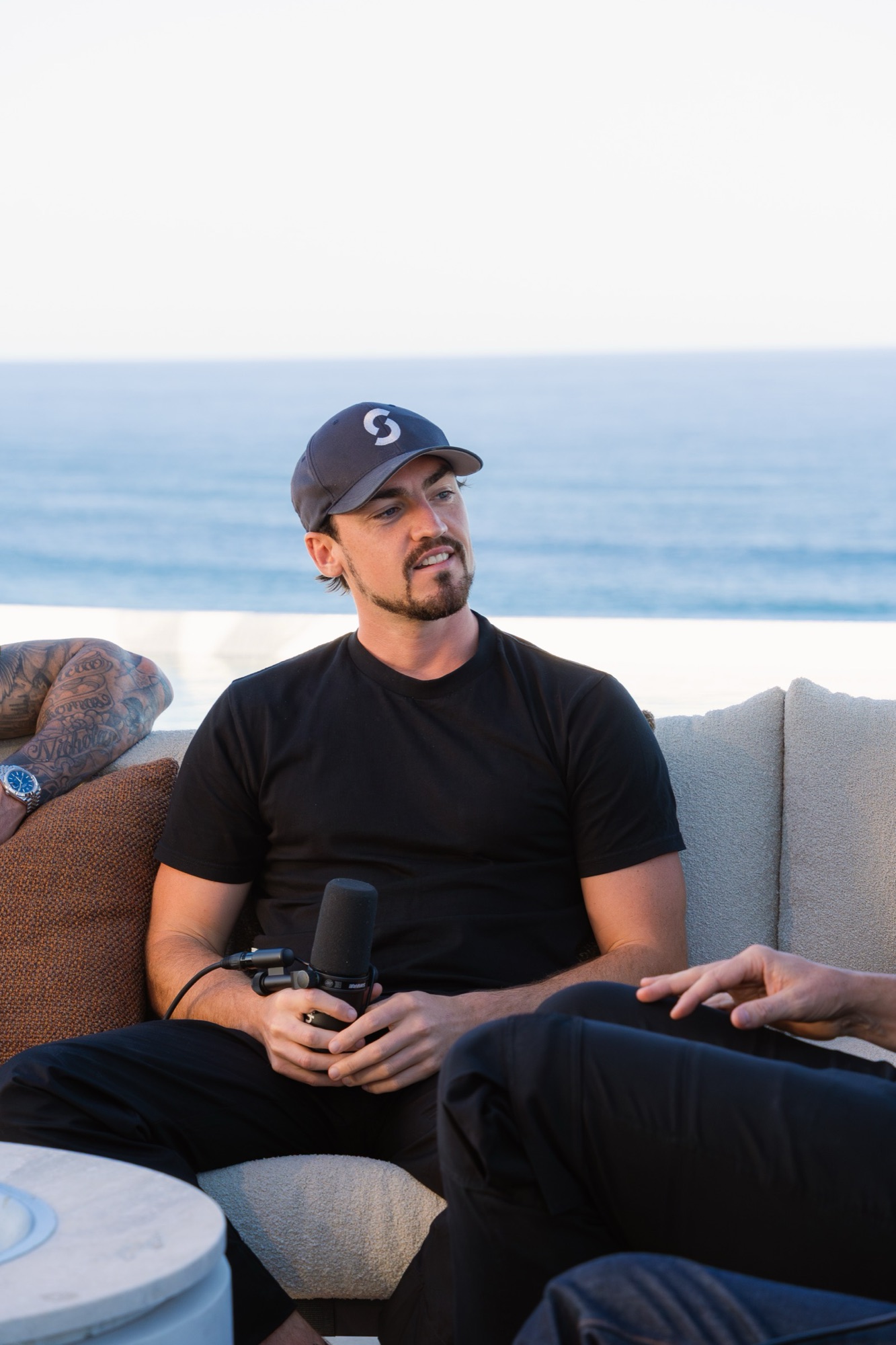 Dan sitting by the ocean